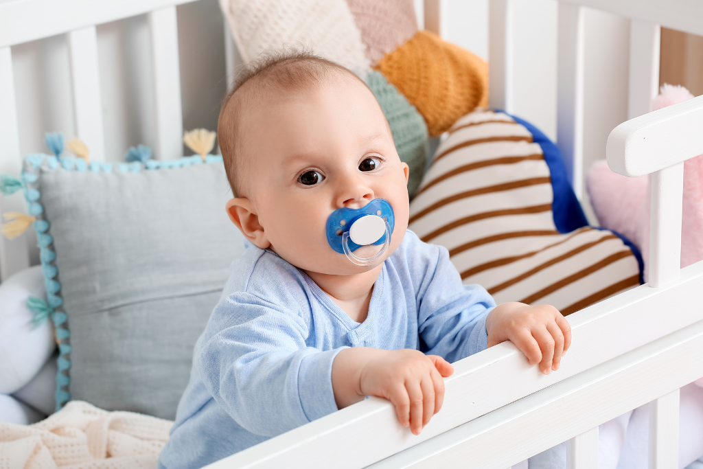 How to keep pacifiers from falling out of crib
